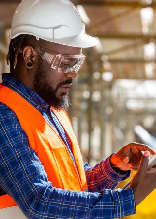 man inspecting a construction site