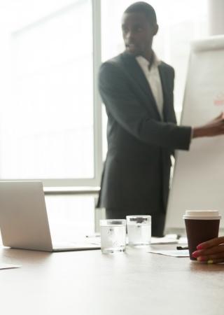 man is training people around a table