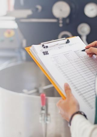 woman is inspecting a food factory